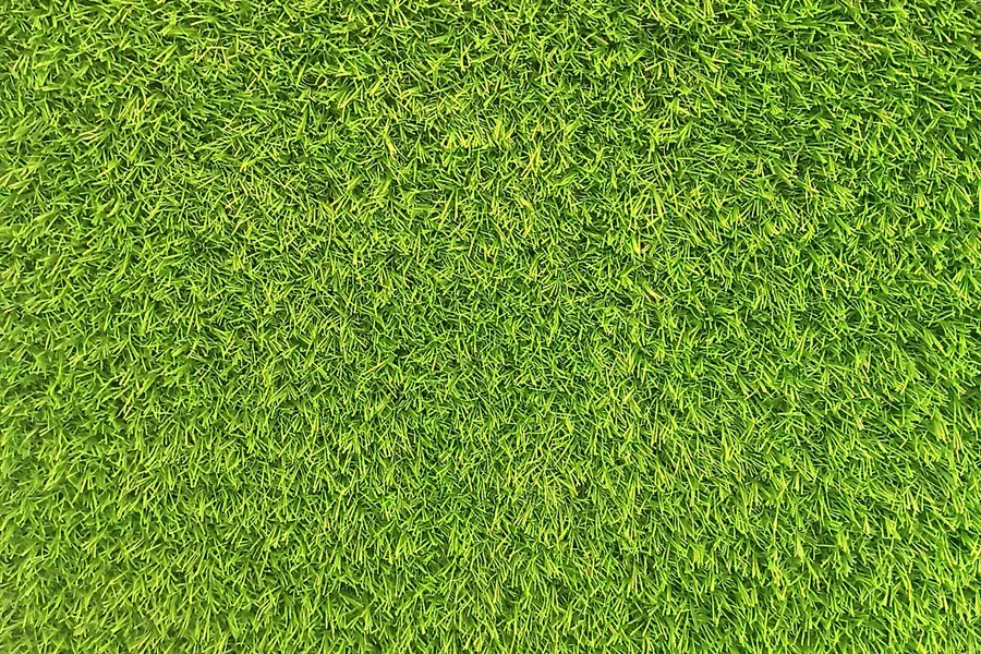 Close-up of bright green artificial grass fibres